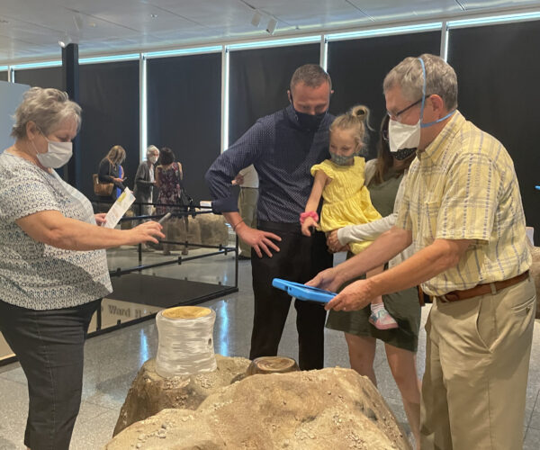 A family views Ginny Ruffner: Reforestation of the Imagination during a member exhibition opening at the KIA on Sept. 17, 2021.