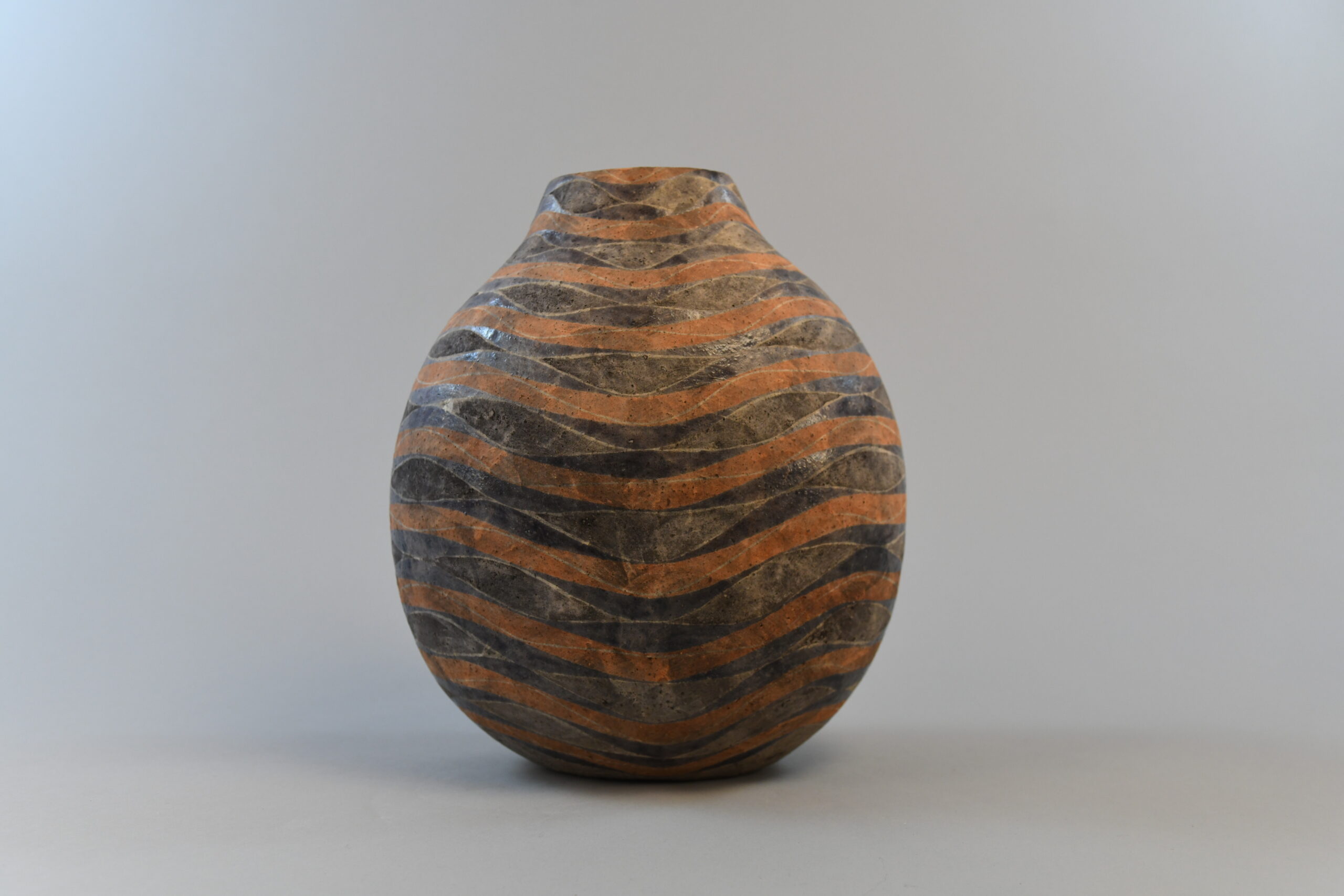Kenzo Okada, Vase with Stream Pattern, 1987, stoneware with matte slip glaze in peach and purple. Promised gift of Carol and Jeffrey Horvitz.